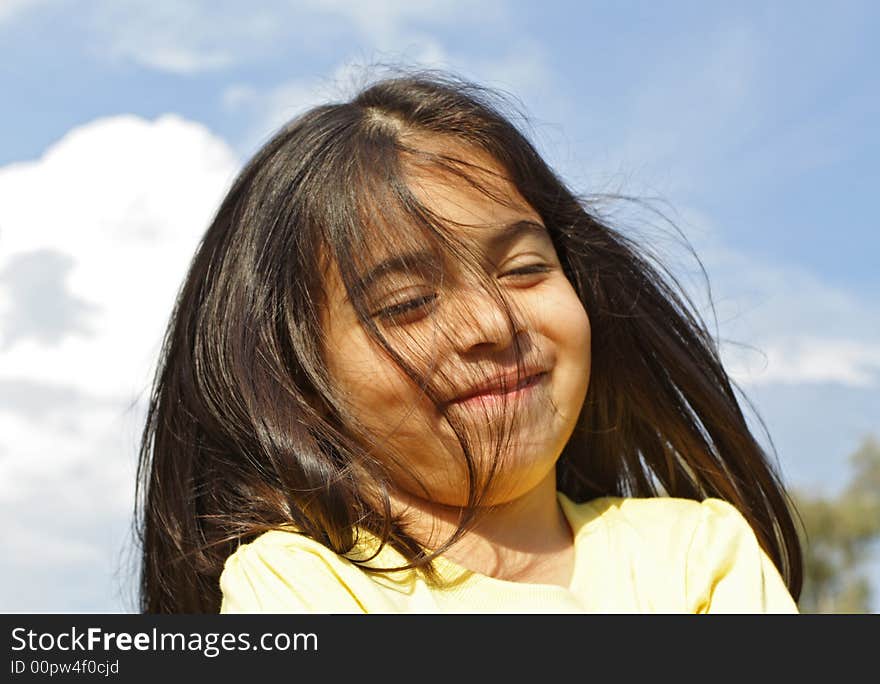 Girl Smiling while outside at the park. Girl Smiling while outside at the park