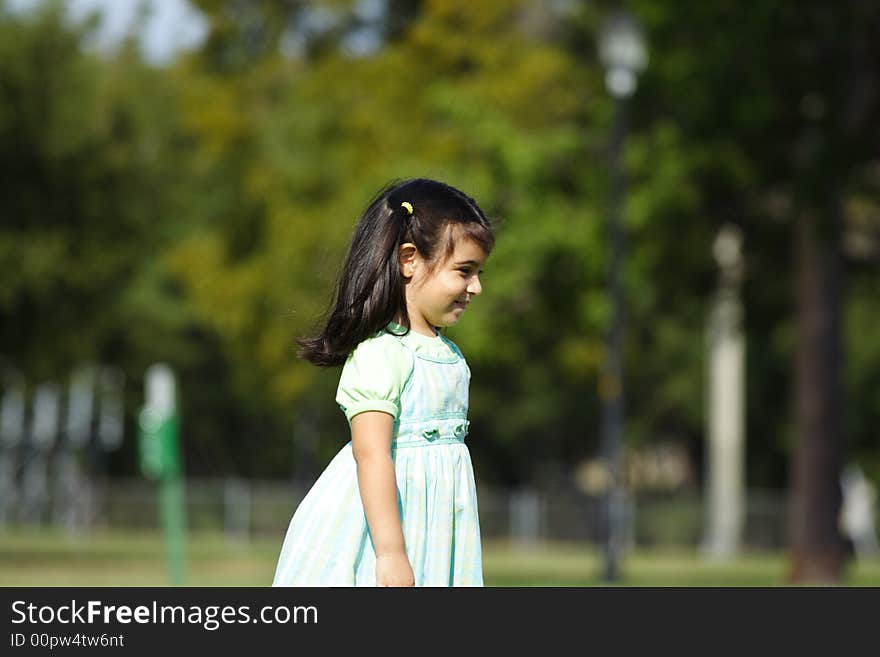 Girl walking around in a park. Girl walking around in a park