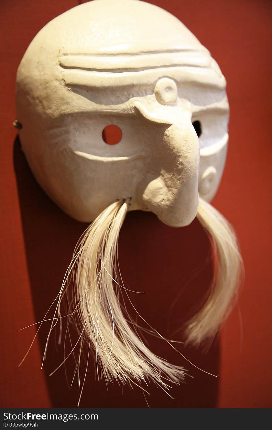 Side view of a mustachioed mask