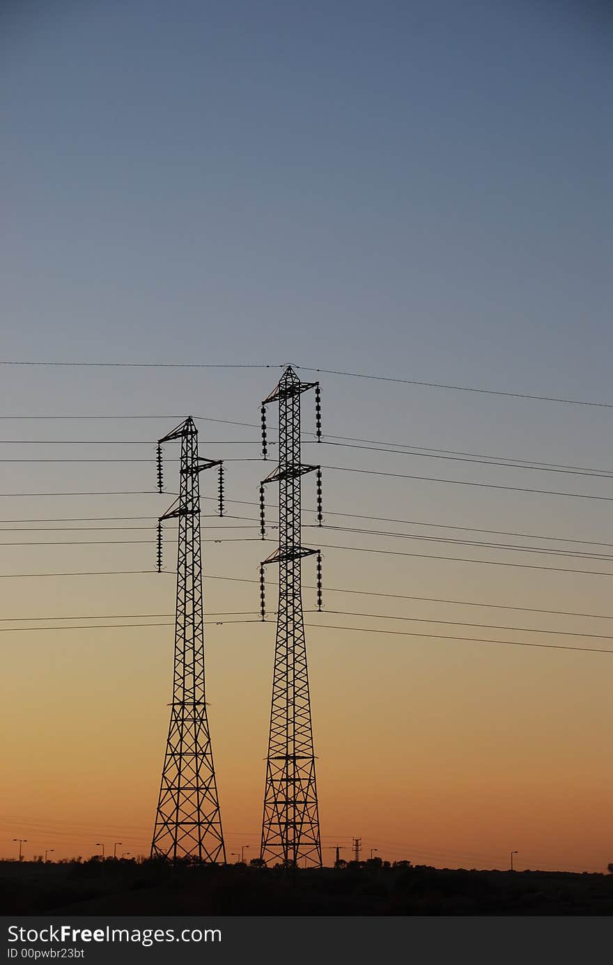 Electrical towers and wires on background sunset. Electrical towers and wires on background sunset