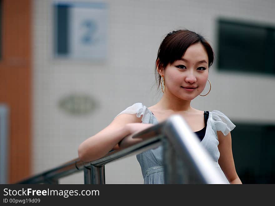 Beautiful Women Rely On Railings