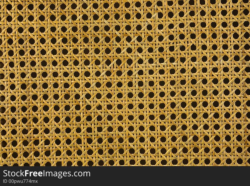 Yellow pattern detail of a wicker chair. Great background. Yellow pattern detail of a wicker chair. Great background