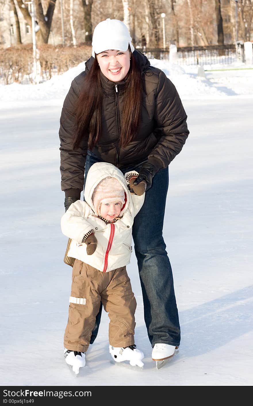 Mother and child on the rink