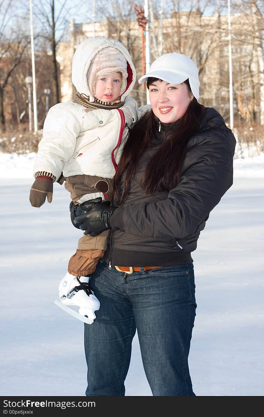 Mother and child on the rink