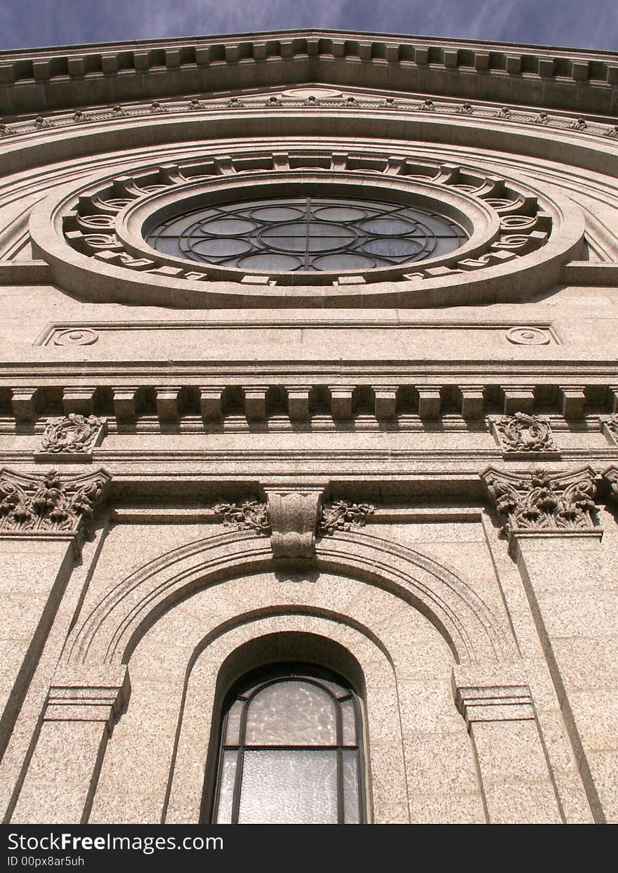 Outside view of round and arched church windows. Outside view of round and arched church windows