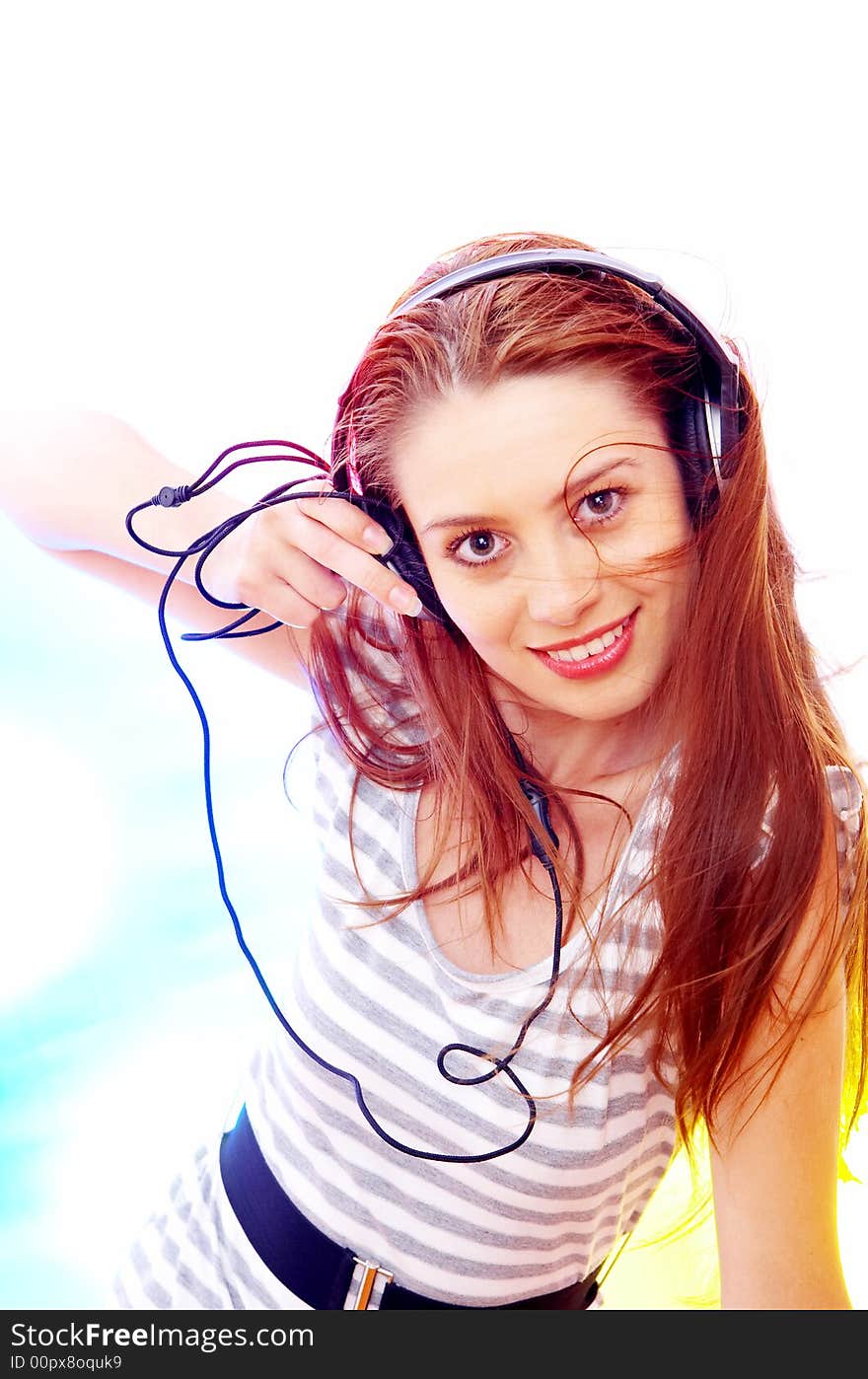 View of young  female listening music via earphones. Image may contain slight multicolor aberration as a part of design. View of young  female listening music via earphones. Image may contain slight multicolor aberration as a part of design.