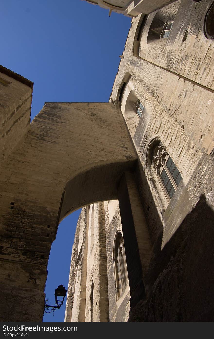 Medieval walls in town, down to top perspective vertical view. France, EU.