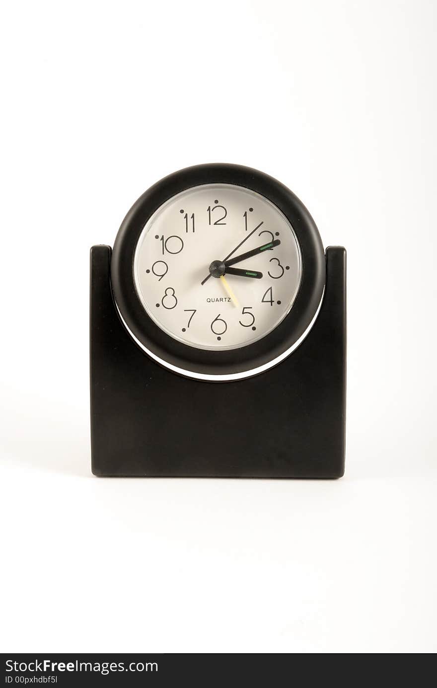 A black clock on isolated white blackground