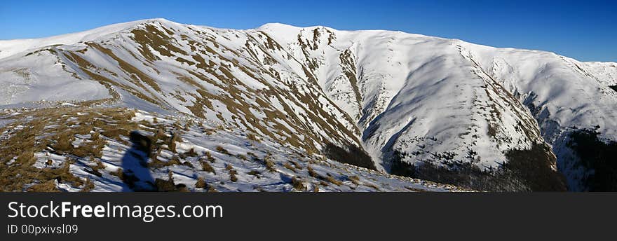 The summit Baiul Mare, is the highest peak of Baiului Mountains (near Bucegi). It is formed from three peaks, with 1890, 1891 and 1895 meters altitude, ian Carpathian Mountains, Romani. The summit Baiul Mare, is the highest peak of Baiului Mountains (near Bucegi). It is formed from three peaks, with 1890, 1891 and 1895 meters altitude, ian Carpathian Mountains, Romani