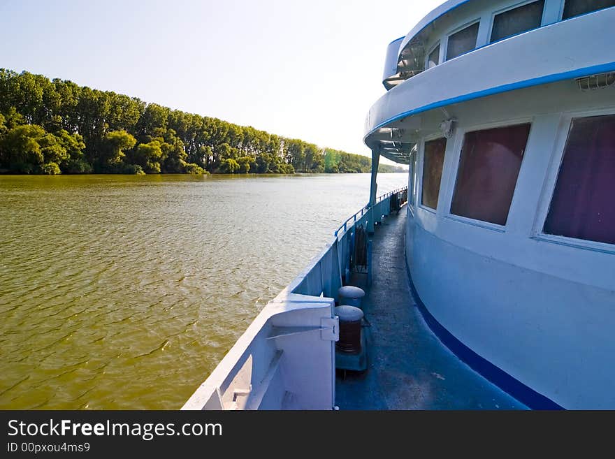 Ship cruising on large river