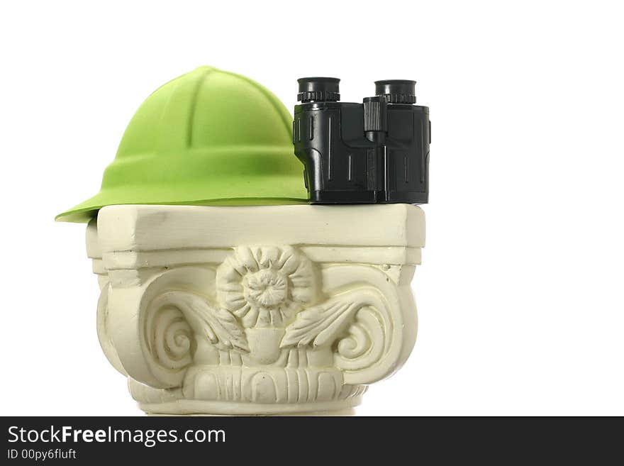 A green adventure hat or pith helmet on a pedestal. A green adventure hat or pith helmet on a pedestal