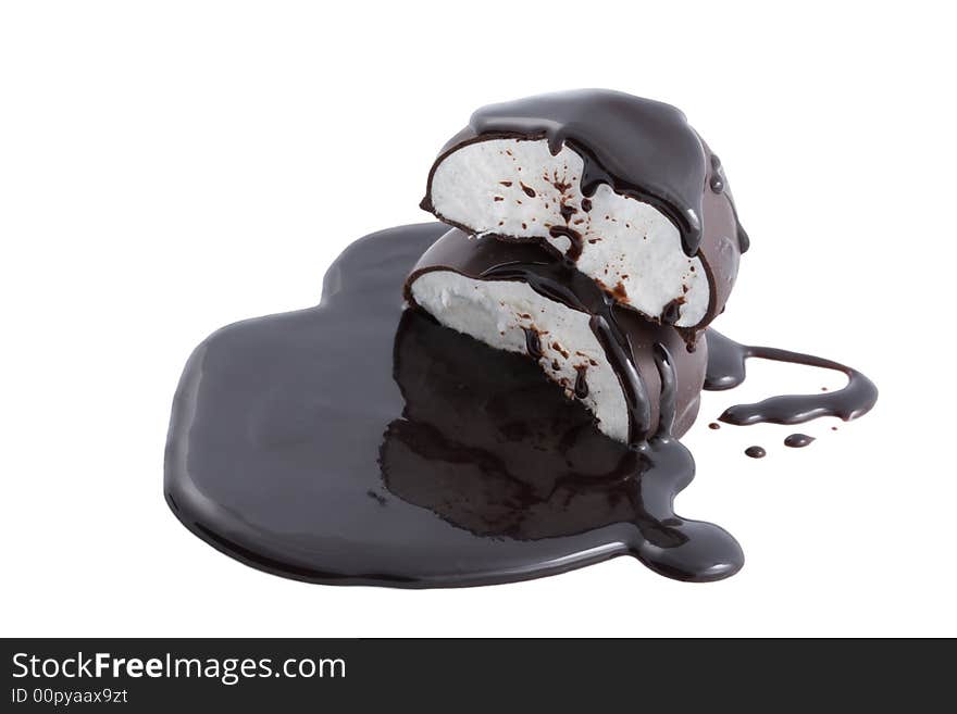 Marshmallows in chocolate syrup isolated