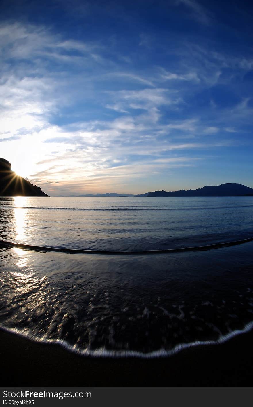 Fisheye lens and slow shutter speed, sunset in Iztuzu beach,Turkey,. Fisheye lens and slow shutter speed, sunset in Iztuzu beach,Turkey,