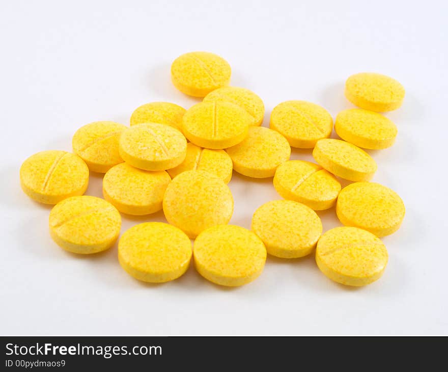 Pile of yellow vitamin tablets. Pile of yellow vitamin tablets