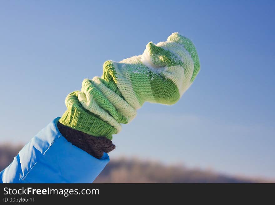 Snow in green hand