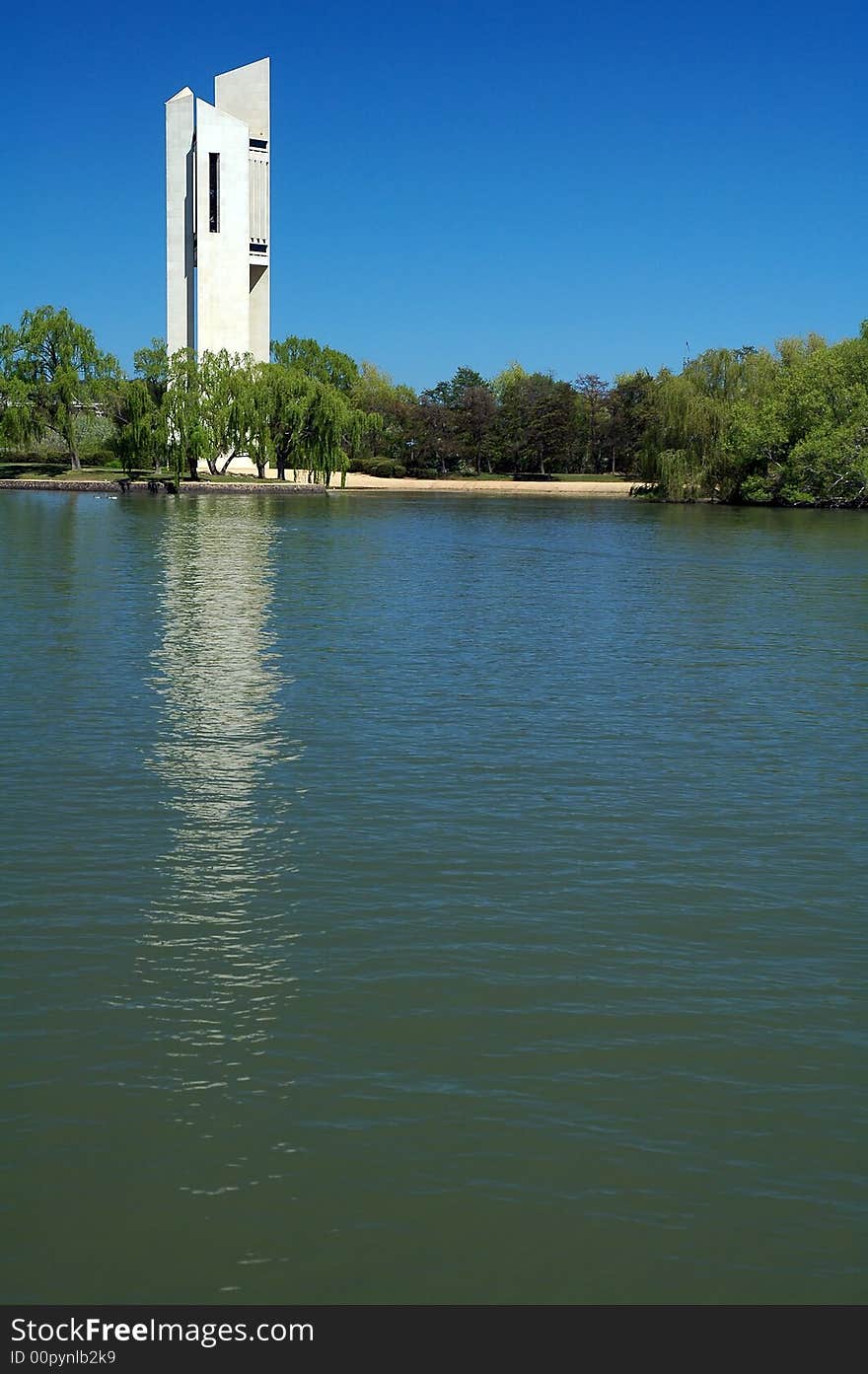 Famous white Carillion in Canberra, lake with boat in foreground