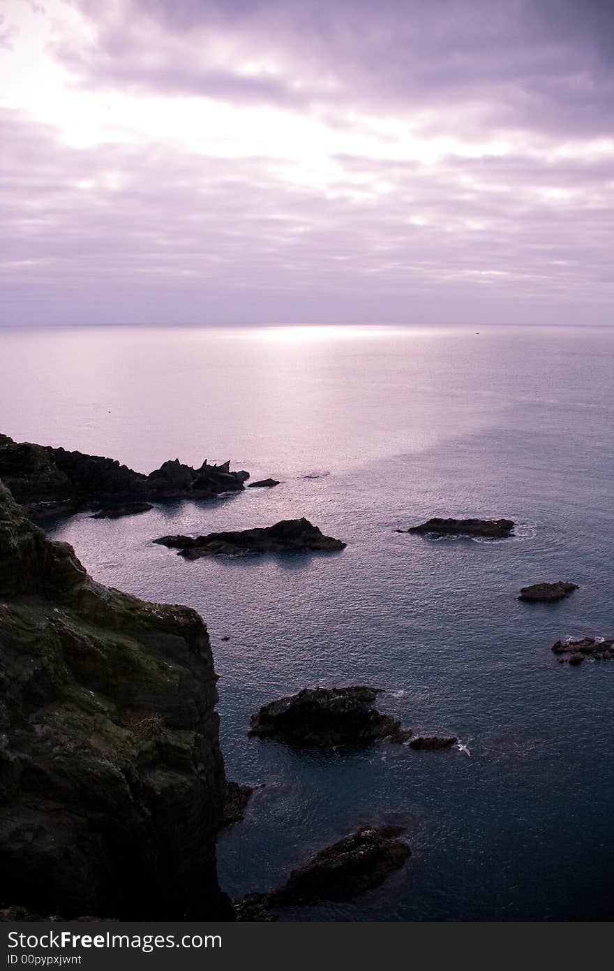 Calm and peaceful seascape with foreground rocks