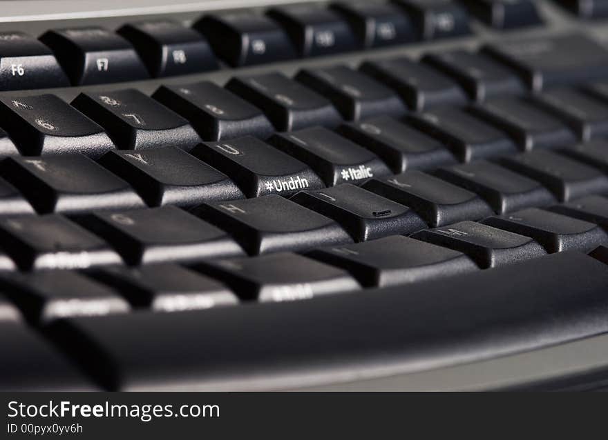 Close-up picture of a modern black ergonomic keyboard