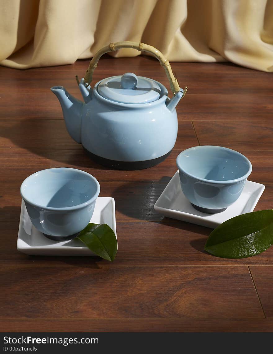 Tea set on parquet floor. Tea set on parquet floor