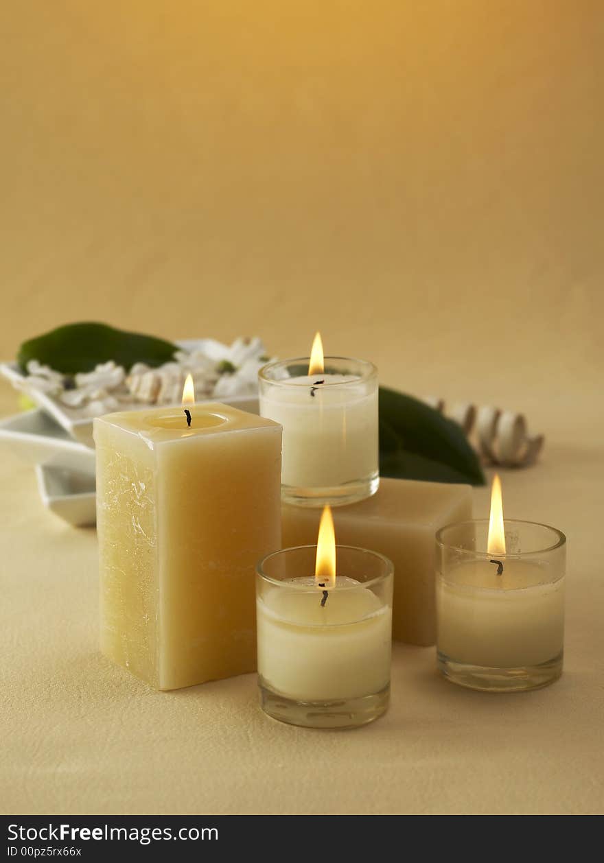 Candles and towels on brown background. Candles and towels on brown background