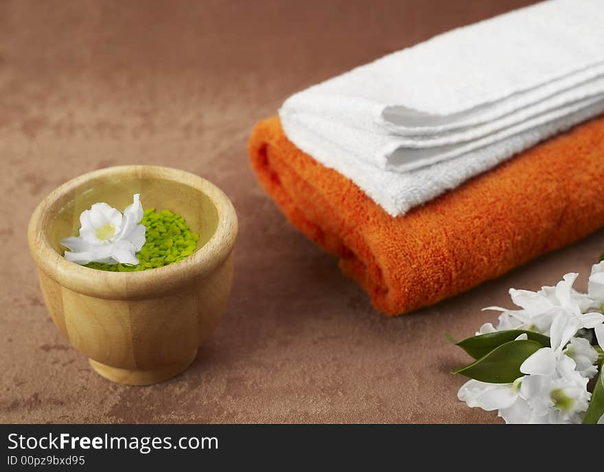 Candles and towels on brown background. Candles and towels on brown background