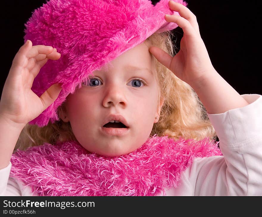 Young girl playing dress up with an inspired look on her face. Young girl playing dress up with an inspired look on her face