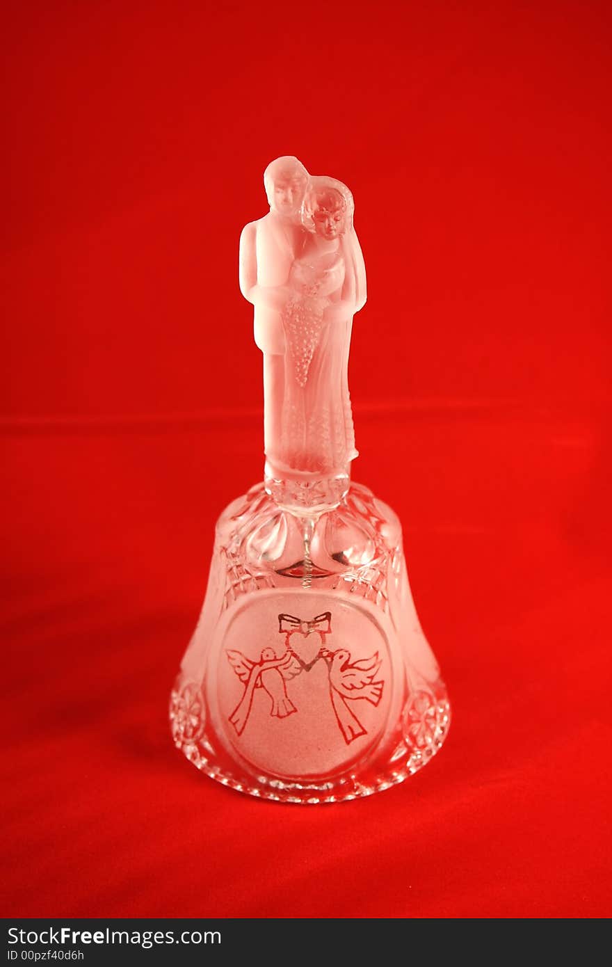 Crystal Bell with young couple as symbol of love