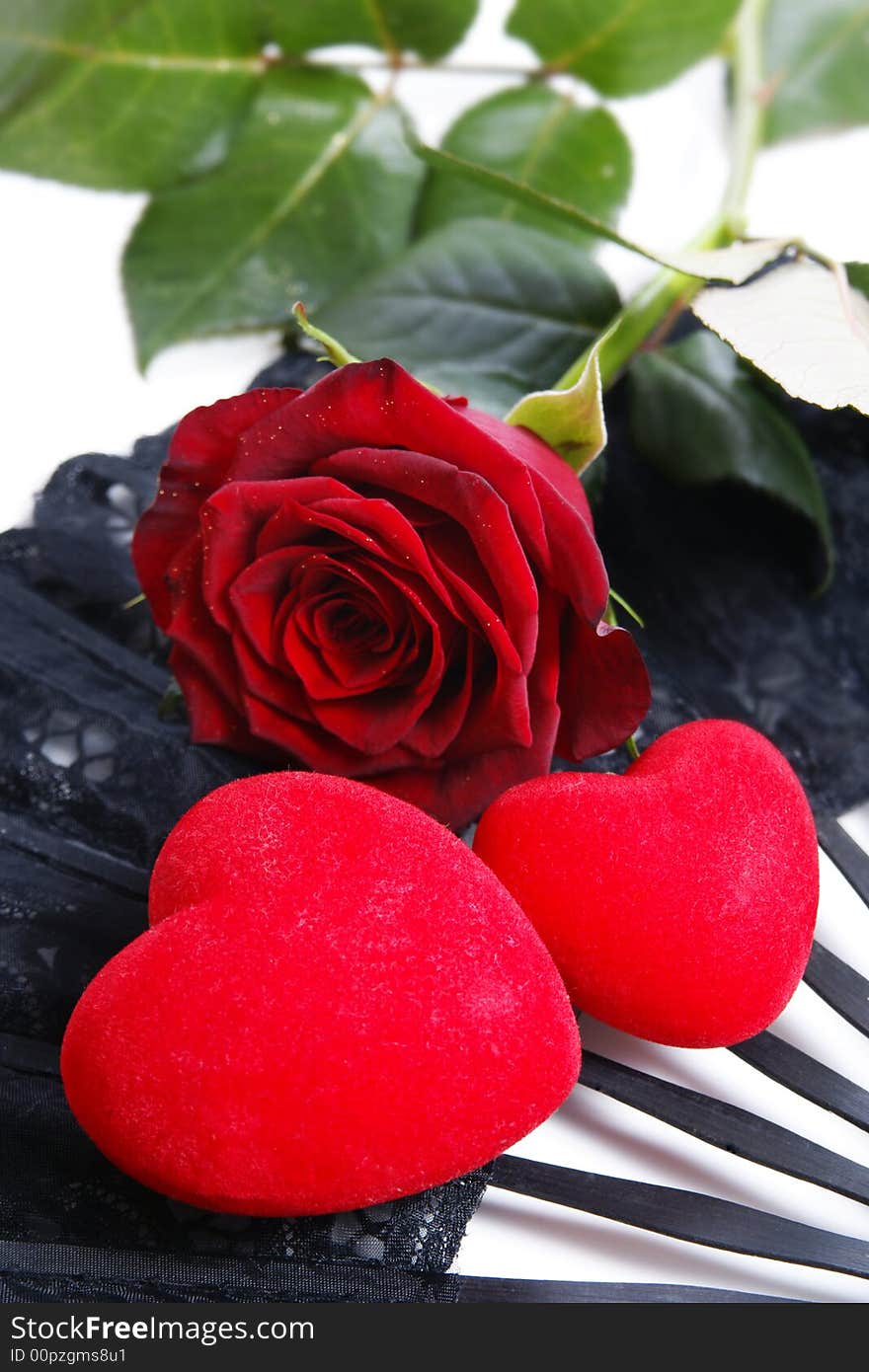 Single red rose on a dark background with hearts. Single red rose on a dark background with hearts