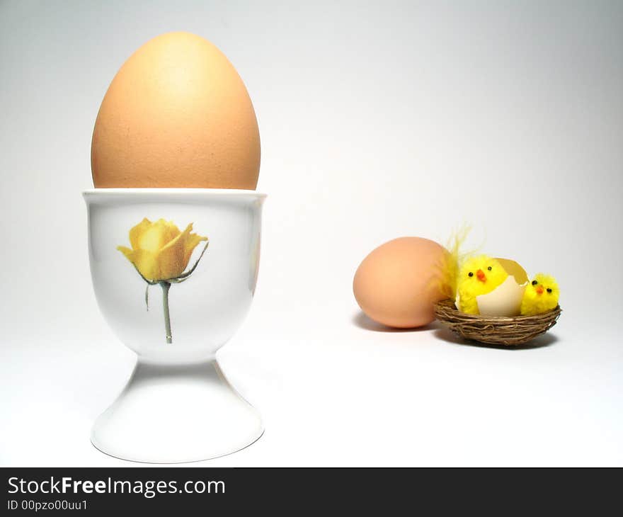 Easter still life with little chicken and two eggs