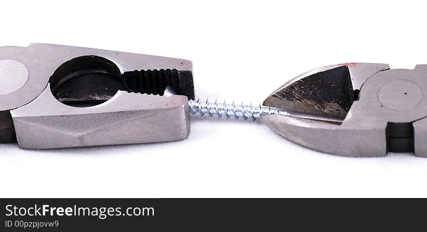 Pliers and cutter handling a screw