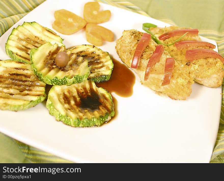 Breaded salmon fillet steaks with zucchini