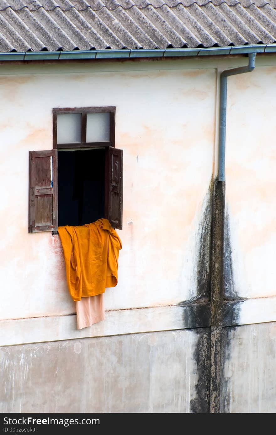 Monks robe drying up from window