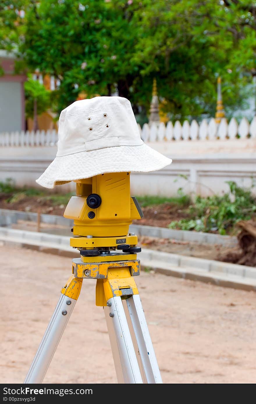 Surveyor equipment with a hat on top of it. Surveyor equipment with a hat on top of it