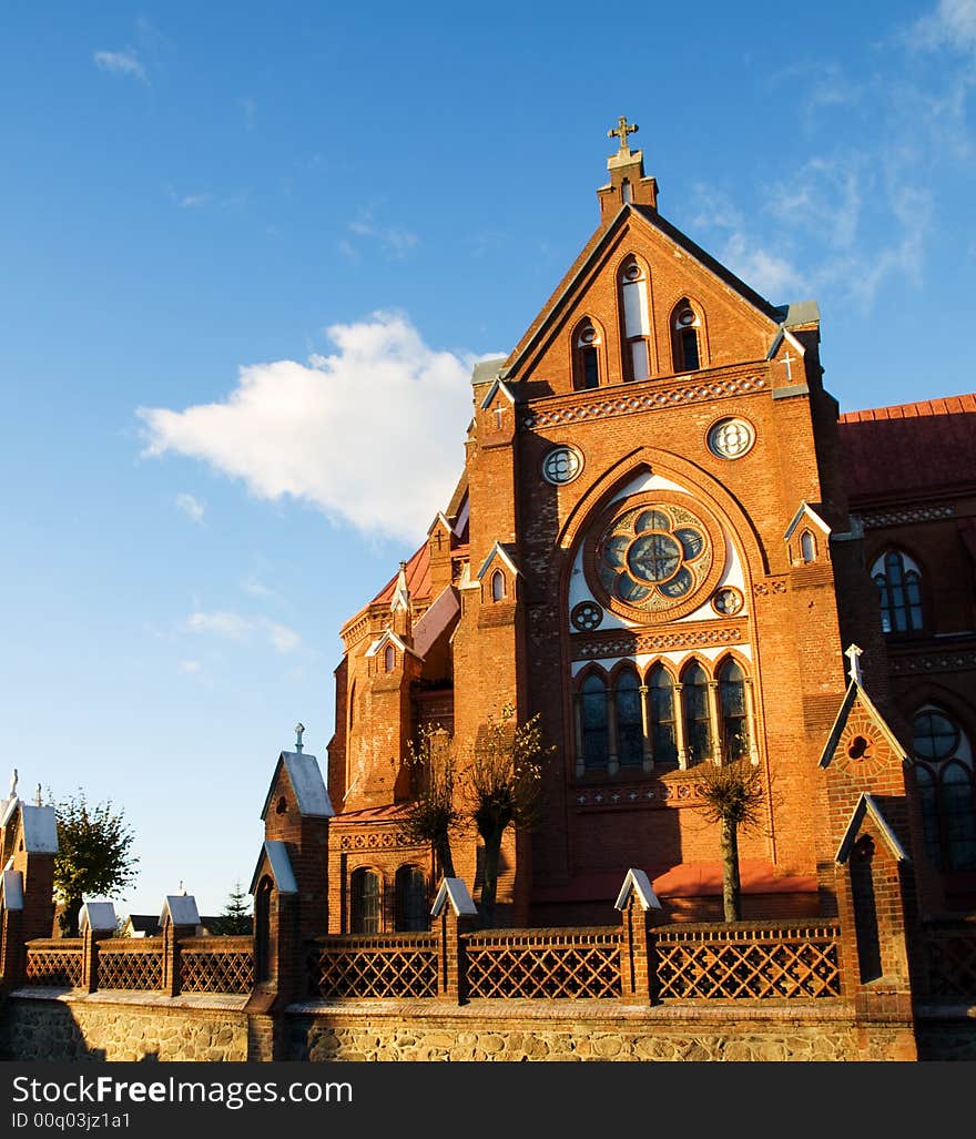 Sunlit old red brick church. Sunlit old red brick church