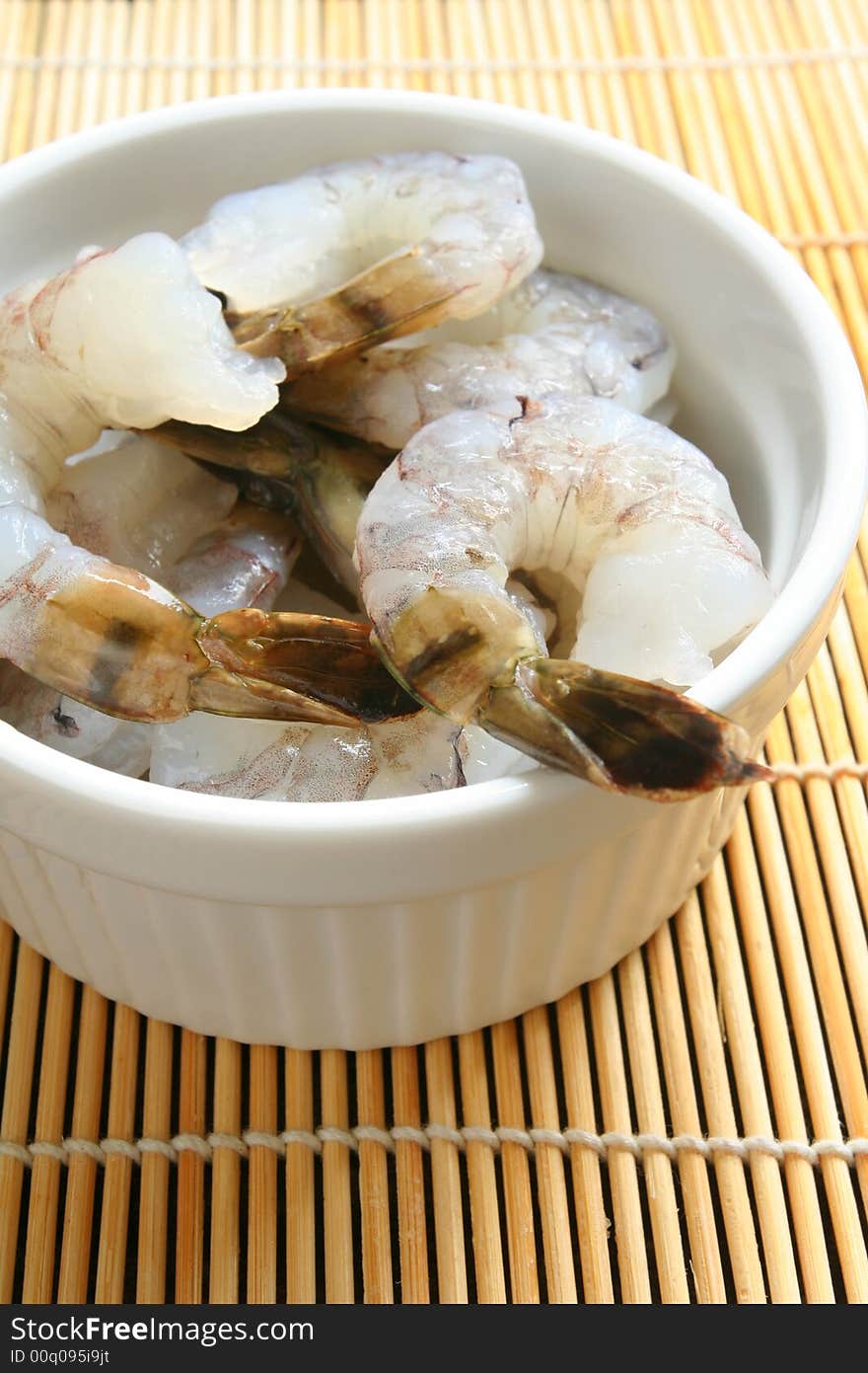 Raw prawns in a white bowl. Raw prawns in a white bowl