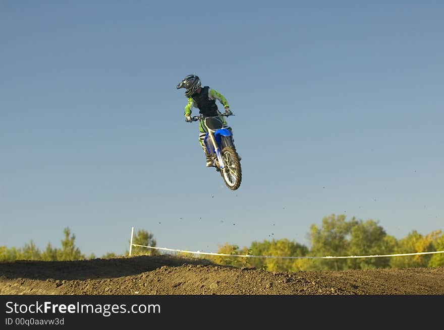 Having fun on a motocross track, motion blur. Having fun on a motocross track, motion blur