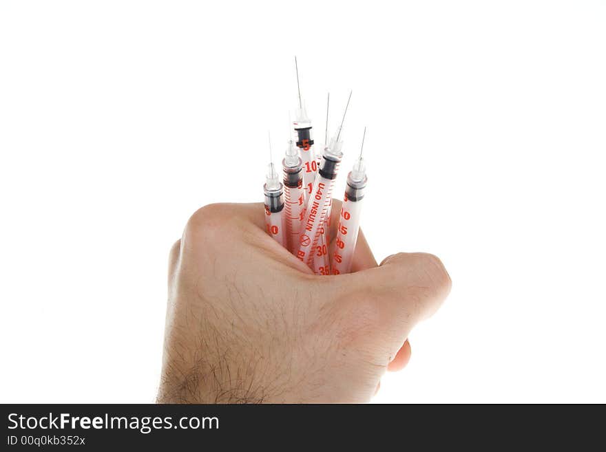 Hand with syringes on a white background