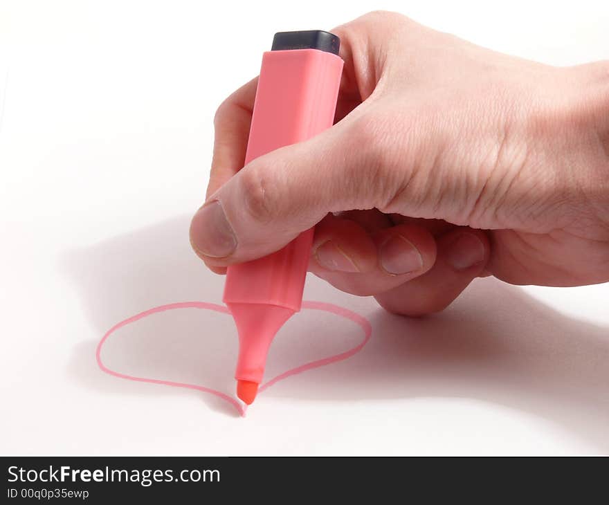 Men (hand) painting purple heart on white paper. Men (hand) painting purple heart on white paper