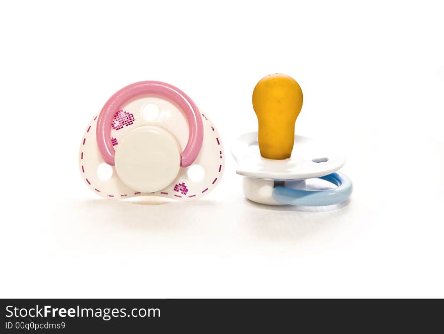 Couple Baby pacifier on white with soft shadow. Couple Baby pacifier on white with soft shadow