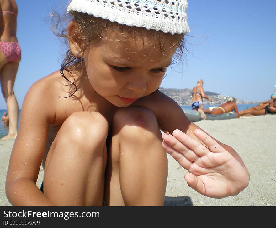 The happy girl on sea beach. The happy girl on sea beach.