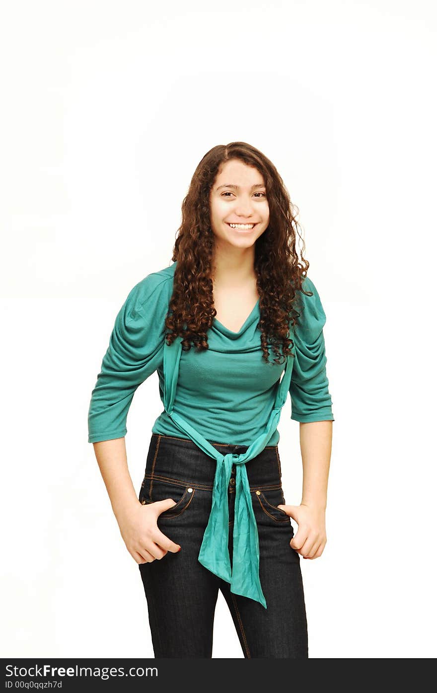 A young girl in jeans and turquoise sweater. A young girl in jeans and turquoise sweater.