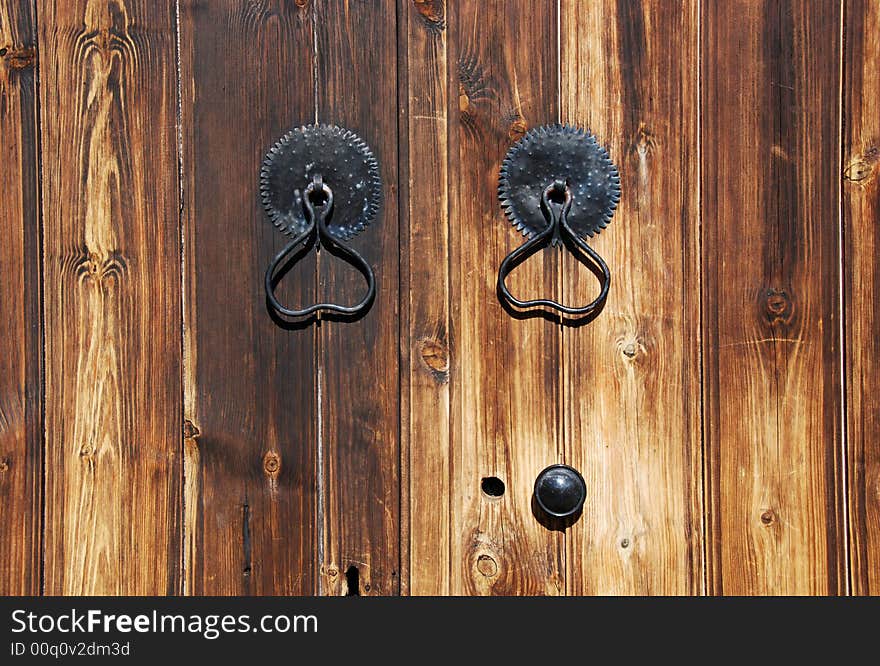 Door handles on a old wooden door