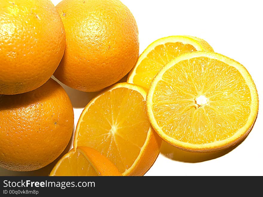 Citrus fruit oranges, whole and sliced, isolated on white