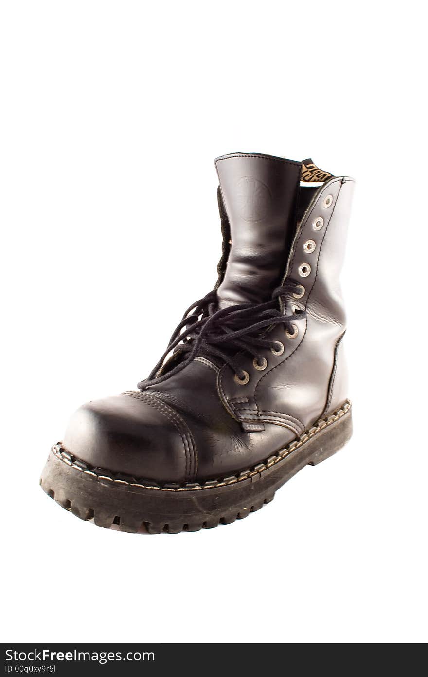 Army style black leather boot isolated on a white background