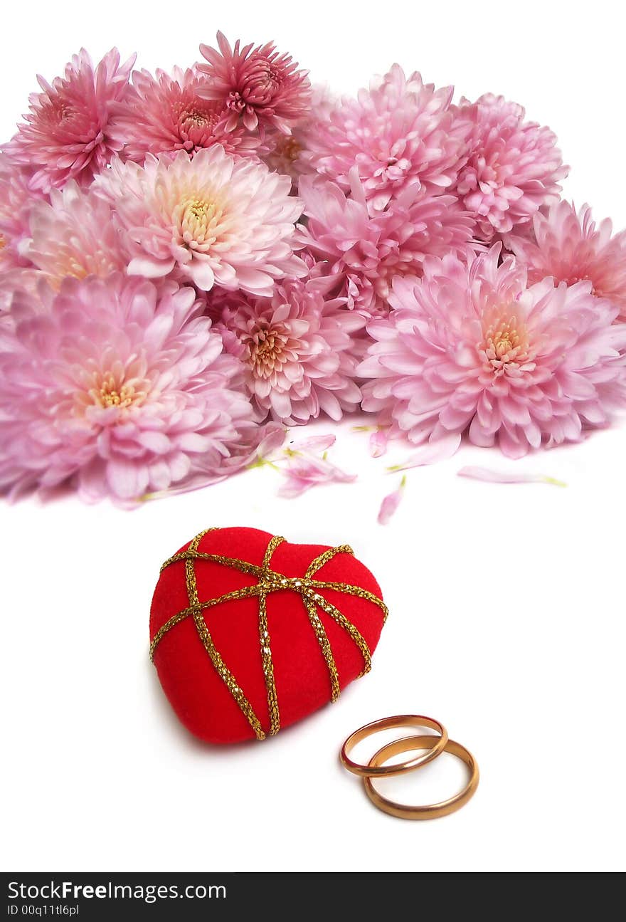 Wedding rings with red velvet heart and bouquet of chrysanthemum. Wedding rings with red velvet heart and bouquet of chrysanthemum