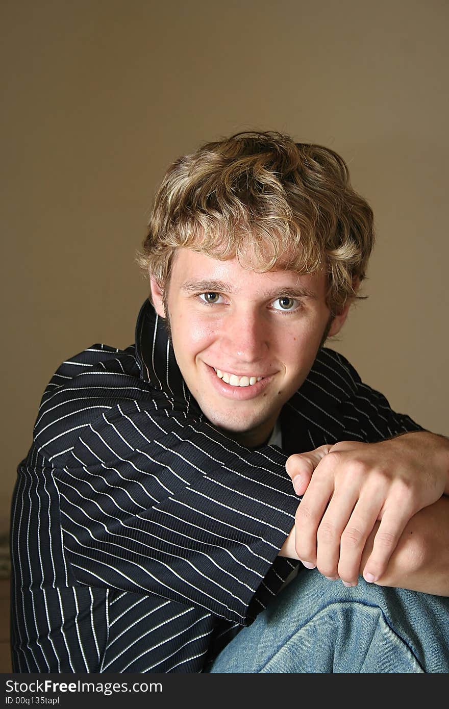 Portrait of a young man smiling.