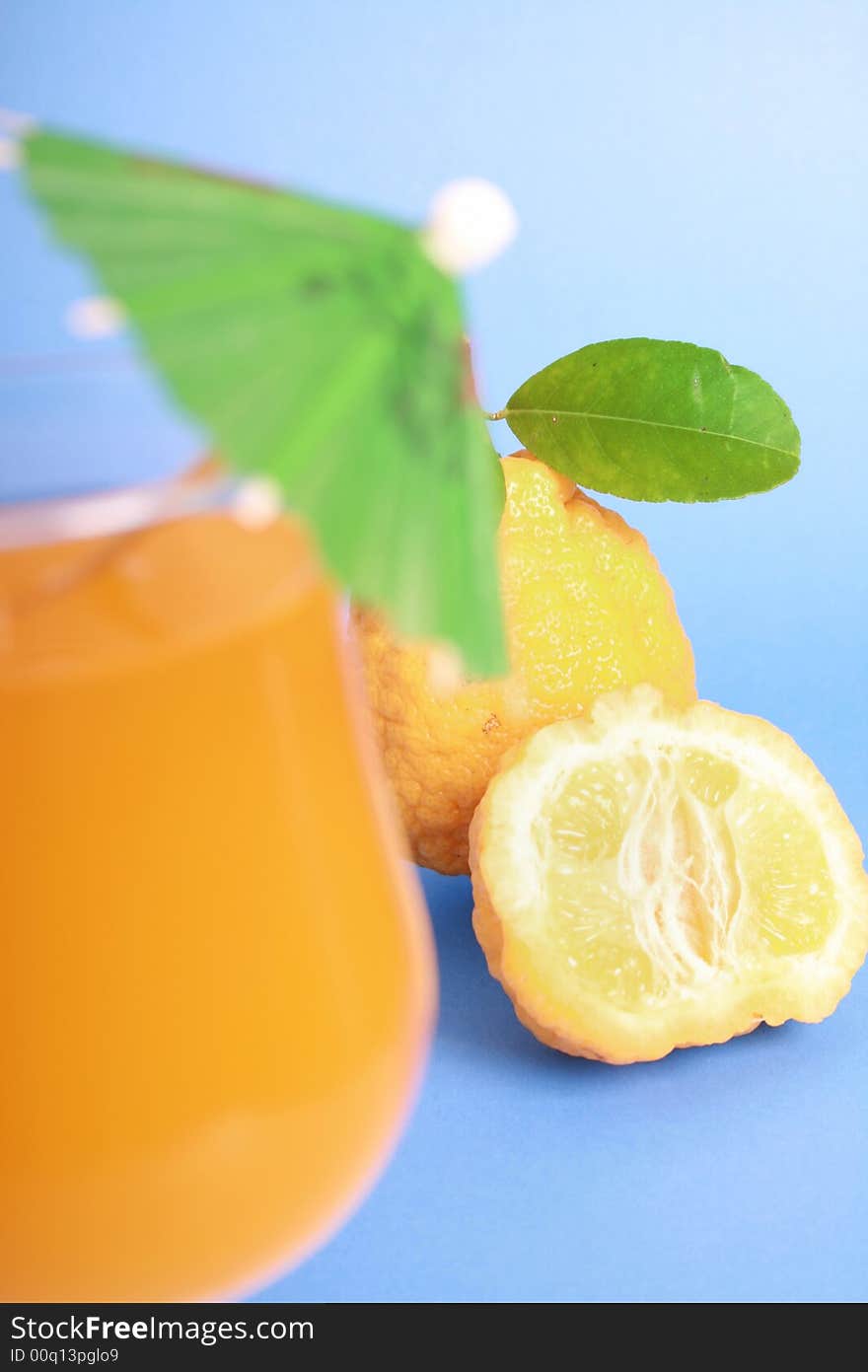 Yellow Lemons and Coctail with Umbrella (Glass out of focus)