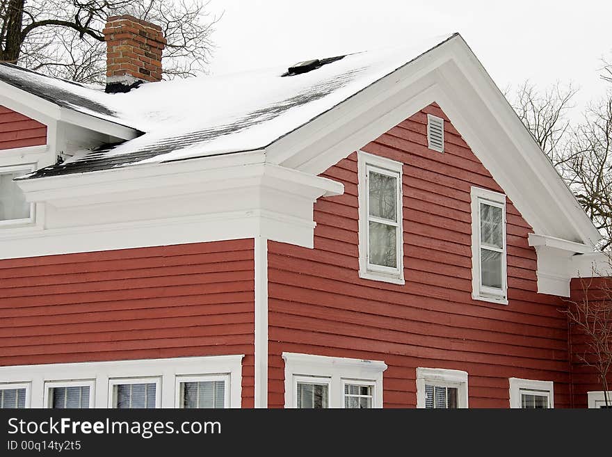 Old weather classic american Greek Revival house detail- a study in red and whote. Old weather classic american Greek Revival house detail- a study in red and whote