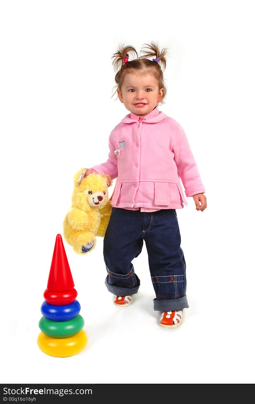 Little girl with her bear toy