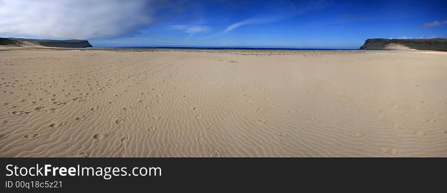 Wide panoramic photo of an idyllic beach. Wide panoramic photo of an idyllic beach.